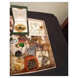 Flat of jewelry including Connemara Marble pin and necklace made in Ireland and Monet earrings