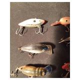 8 fishing lures including 1 wooden lure (See Details)
