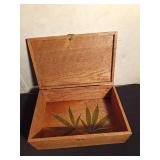 Wood box with marijuana leaves decoupaged on inside bottom