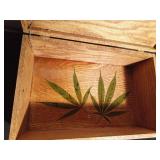 Wood box with marijuana leaves decoupaged on inside bottom
