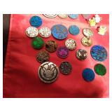 Lot of Pokemon trading coins and pins