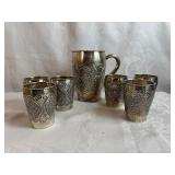 Antique Silver Drinkware Set includes Pitcher and Six Glasses featuring Intricate Embossed Floral Design (Silver marking on bottom of each piece)