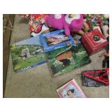 Covered tote filled with toys puzzl...
