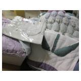 2 Large tubs filled with bedding an...