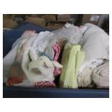 2 Large tubs filled with bedding an...