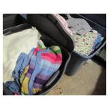 2 Covered totes of ladies clothes...