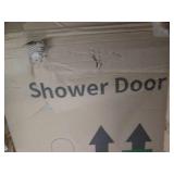 Silver trimmed glass shower door...