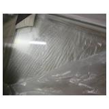 Silver trimmed glass shower door...