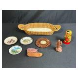 Collection of Vintage Souvenir Plates, Wicker Basket, Russian Nesting Doll, and Decorative Items