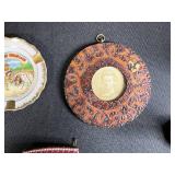 Collection of Vintage Souvenir Plates, Wicker Basket, Russian Nesting Doll, and Decorative Items