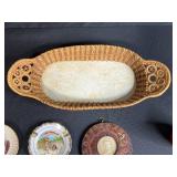 Collection of Vintage Souvenir Plates, Wicker Basket, Russian Nesting Doll, and Decorative Items
