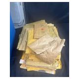 Collection of Used Padded Mailers in Storage Tote