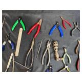 Collection of Hand Tools with Pliers, Files, Screwdrivers, and Magnifier