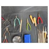 Collection of Hand Tools with Pliers, Files, Screwdrivers, and Magnifier