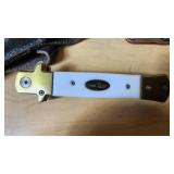 Lot of Knives and Tools Including Buck Knife, Victorinox Swiss Army Knife, and Vintage Fixed Blade