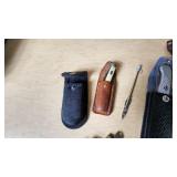 Lot of Knives and Tools Including Buck Knife, Victorinox Swiss Army Knife, and Vintage Fixed Blade