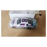 NASCAR Collectibles Including Ertl Die-Cast Car, Dale JR and Jeff Gordon Ornaments, and Dale Earnhardt Documentary