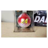NASCAR Collectibles Including Ertl Die-Cast Car, Dale JR and Jeff Gordon Ornaments, and Dale Earnhardt Documentary