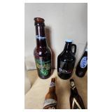 Collection of Beer Memorabilia including Schlitz Pitcher, Budweiser Mardi Gras 2001 Bottle, and Bad Habit Brewing Growler