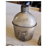 Aladdin N-E C1 Hand Warmer, Luverne National Bank Mechanical Bank, Vintage Military Canteen, and Balance Scale