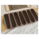 Antique Cast Iron Kitchenware Set including Corn Cob Pan, Spring Handle, and All-In-One Grater