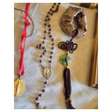 Religious Items Collection including Crosses, Rosaries, and Figurines