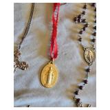 Religious Items Collection including Crosses, Rosaries, and Figurines