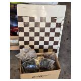 Box Full of Chess Pieces and Metal Chess Board