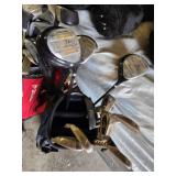 Spalding and Dunlop Golf Club Bags with Various Clubs