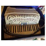 Vintage Venucci Accordion with Case and Sheet Music - Appears in Good Condition