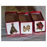 Liz Claiborne Holiday Brooch Set Including Christmas Tree, Bow, and Poinsettia Designs