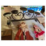 Christmas-themed decorations including Santa signs and candle holder, plus holiday decor items