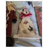 Christmas-themed decorations including Santa signs and candle holder, plus holiday decor items