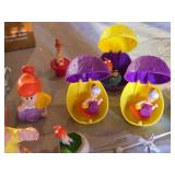 Assorted Vintage Toy Collection Including Flintstones, Dinosaurs, and Puzzle Games