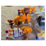 Assorted Vintage Toy Collection Including Flintstones, Dinosaurs, and Puzzle Games