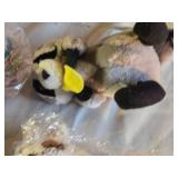 Pastel Plush Bunny, Crocheted Blanket, and Assorted Stuffed Toys