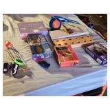 Lot of Puzzle and Toy Items including Skip-It, Bingo Bottle Stand, and Jigsaw Puzzles