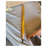 Assorted Office and Craft Supplies including Giant Pencil Decor, Cable Organizer, Glue Stic Foam Cushion Roll, and Miscellaneous Tools