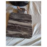 Slow cooker with digital display, baking dish, cutting boards, and floral arrangement