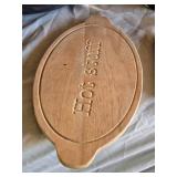 Slow cooker with digital display, baking dish, cutting boards, and floral arrangement