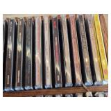 Lot of CDs and DVDs including Ted Nugent, Nazareth, Janis Joplin, Allman Brothers, Frank Sinatra Vegas Box Set, Beastie Boys Anthology, and Classic Rock Collections