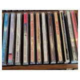 Lot of CDs and DVDs including Ted Nugent, Nazareth, Janis Joplin, Allman Brothers, Frank Sinatra Vegas Box Set, Beastie Boys Anthology, and Classic Rock Collections