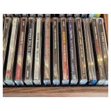Lot of CDs and DVDs including Ted Nugent, Nazareth, Janis Joplin, Allman Brothers, Frank Sinatra Vegas Box Set, Beastie Boys Anthology, and Classic Rock Collections