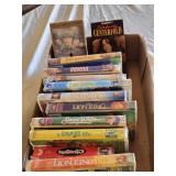 Box of VHS Tapes including Pocahontas, Shrek, and The Lion King among others