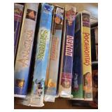 Box of VHS Tapes including Pocahontas, Shrek, and The Lion King among others