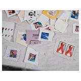 Lot of Postage Stamps Featuring Various Designs and Themes