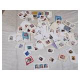 Collection of Vintage USA Postage Stamps Including Christmas, Love, and Flag Designs