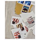 Collection of Vintage USA Postage Stamps Including Christmas, Love, and Flag Designs