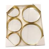 Home decor set with a sleek circular mirror, a "gather" sign, and small signs that say "family" and "happy place.