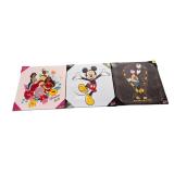 Three Disney pictures on canvases: Mickey Mouse, Disney Princess, and The Nightmare Before Christmas.
